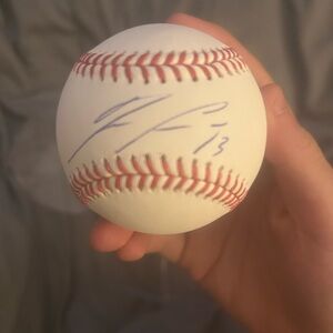 Autographed 2021 Ronald Acuña jr ball with authentication sticker and case